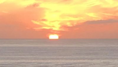 a sunset over a beach